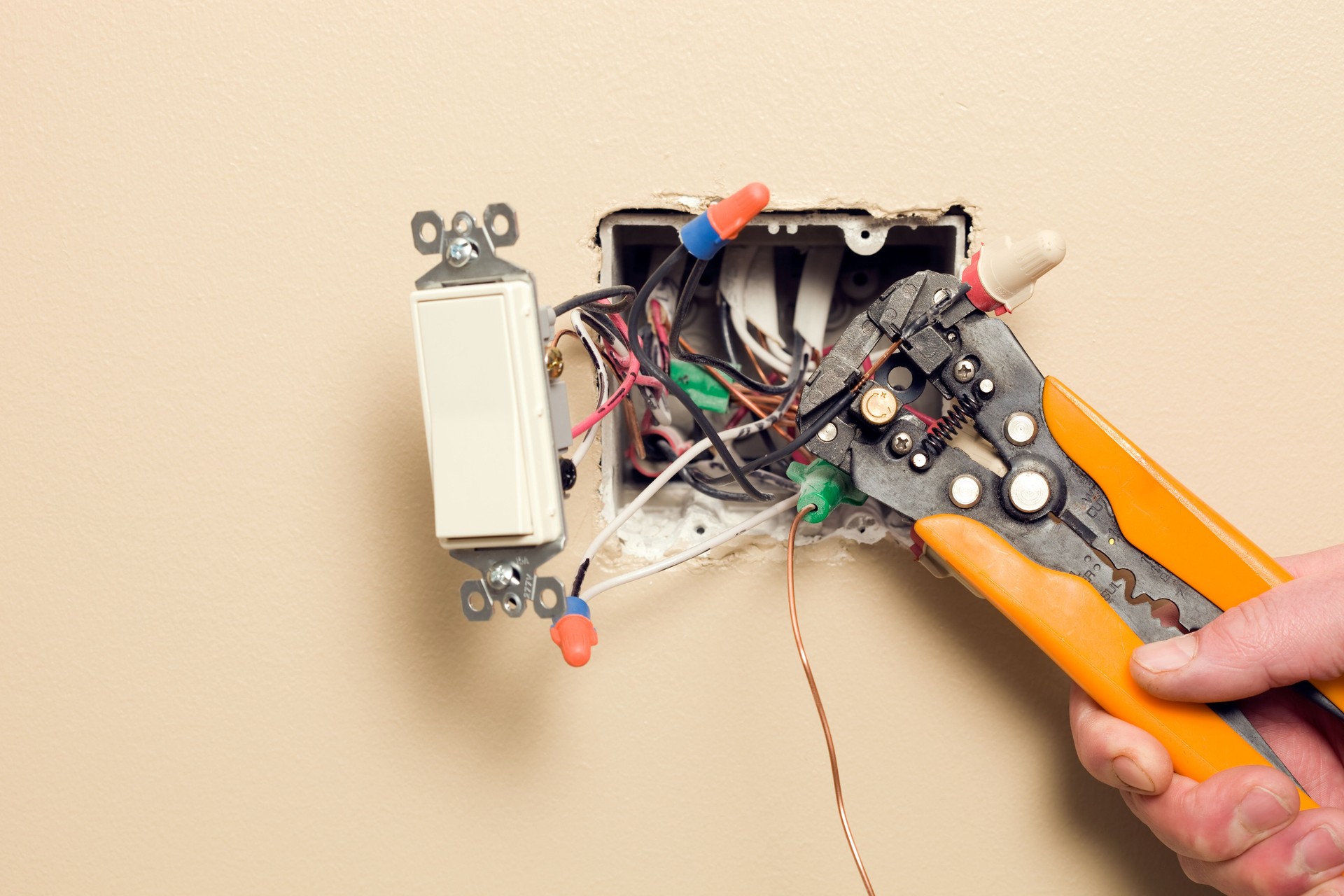 Electrician Stripping Wire for Wall Switch Box